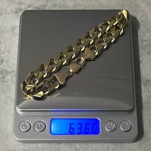 14K gold bracelet. Made in Italy. 9 inch chain. 12.5mm wide.